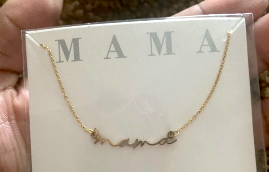 holding mom's necklace 