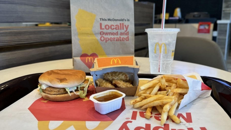 mcdonalds menu items, chicken sandwich, 4 piece nuggets, and fries, with a drink