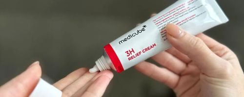 hand holding medicube cream