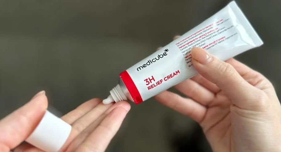 hand holding medicube cream