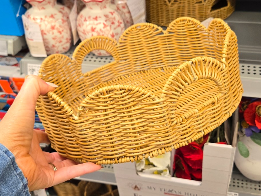 hand holding scallop rattan tray 
