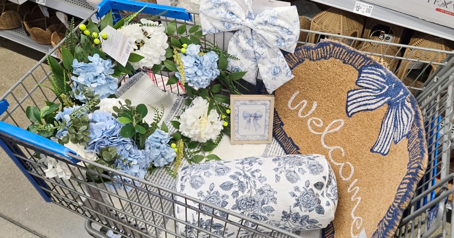 shopping cart full of blue and white wreath, pillows, bows, decor and more