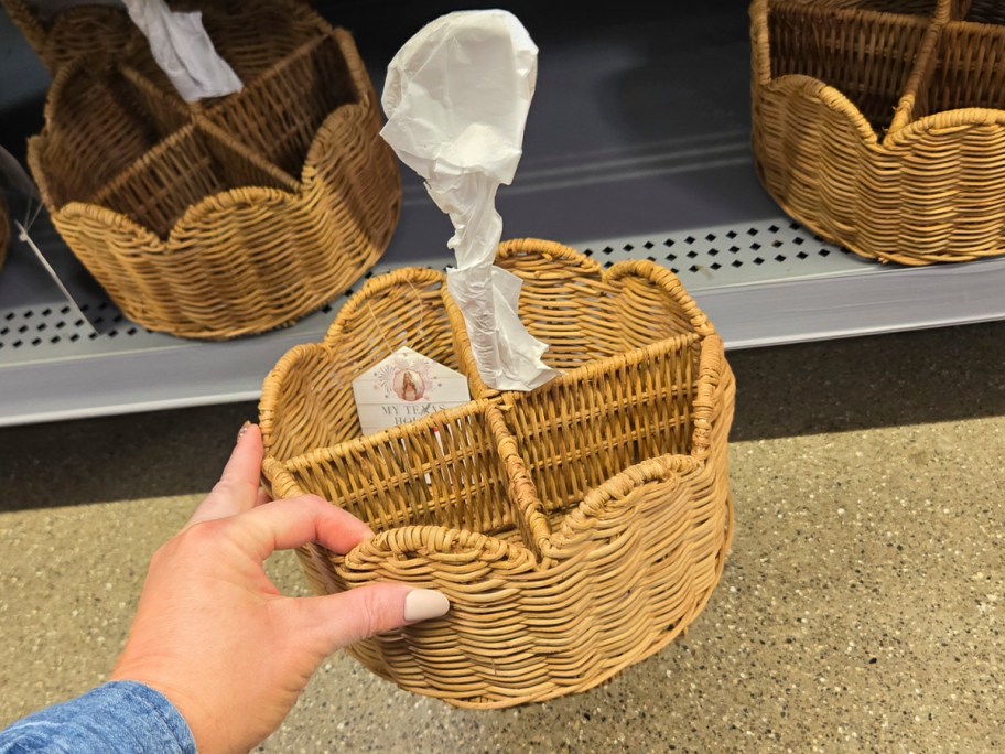 hand holding rattan utensil holder 