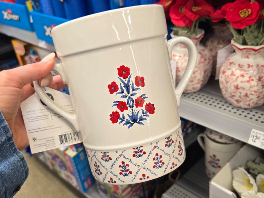 hand holding utensil crock 