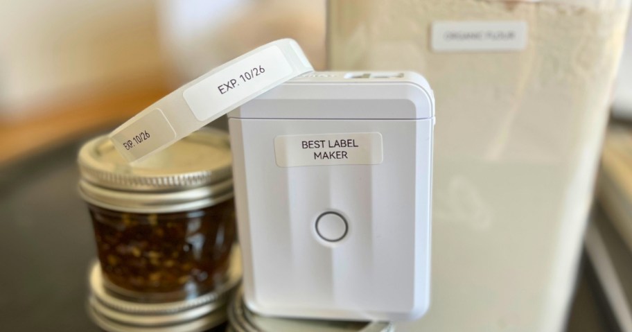 label maker with labels next to food storage containers with labels on them