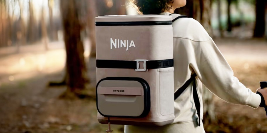 person wearing tan ninja backpack cooler