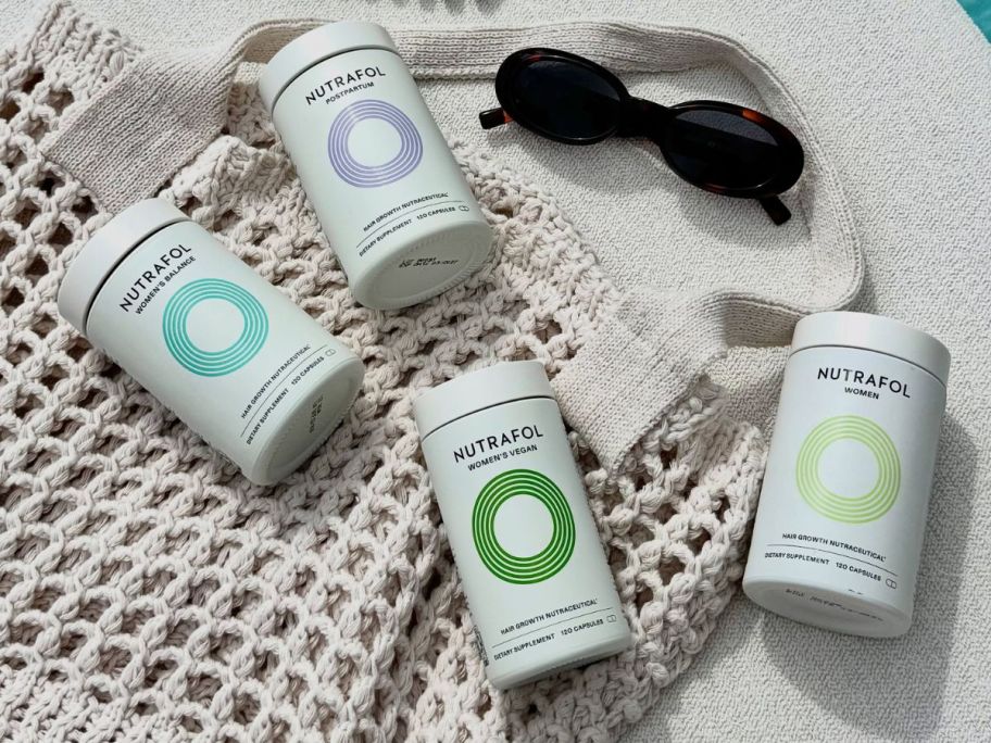 nutrafol supplement bottles on tote bag