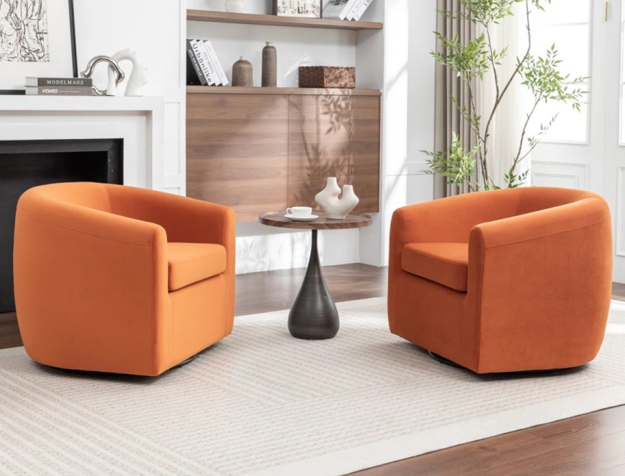 two orange upholstered swivel chairs