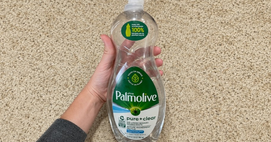 hand holding a large bottle of Palmolive dish soap