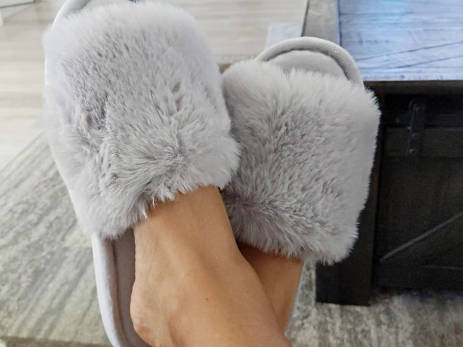 person wearing gray slippers 