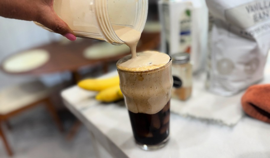 pouring a banana milk latte 