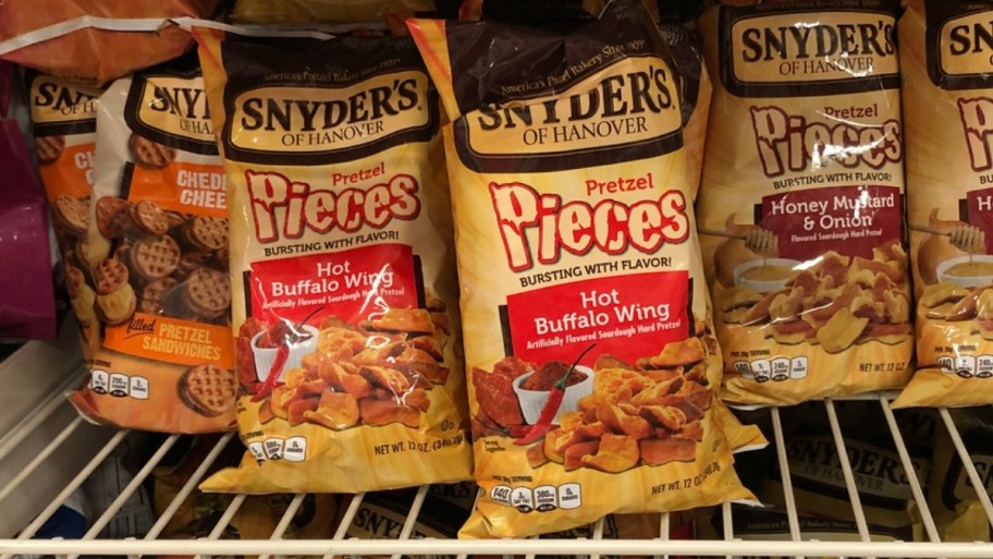 snyders hot wing pretzel pieces bags on a store shelf