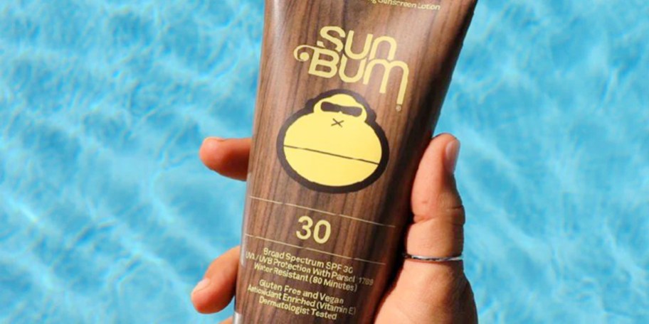 hand holding sun bum sunscreen