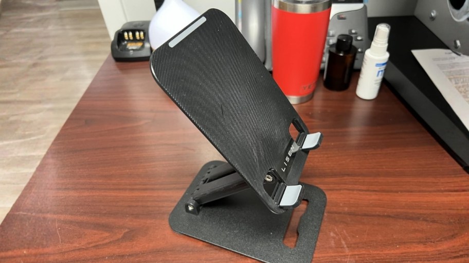 a black tablet stand on a desktop