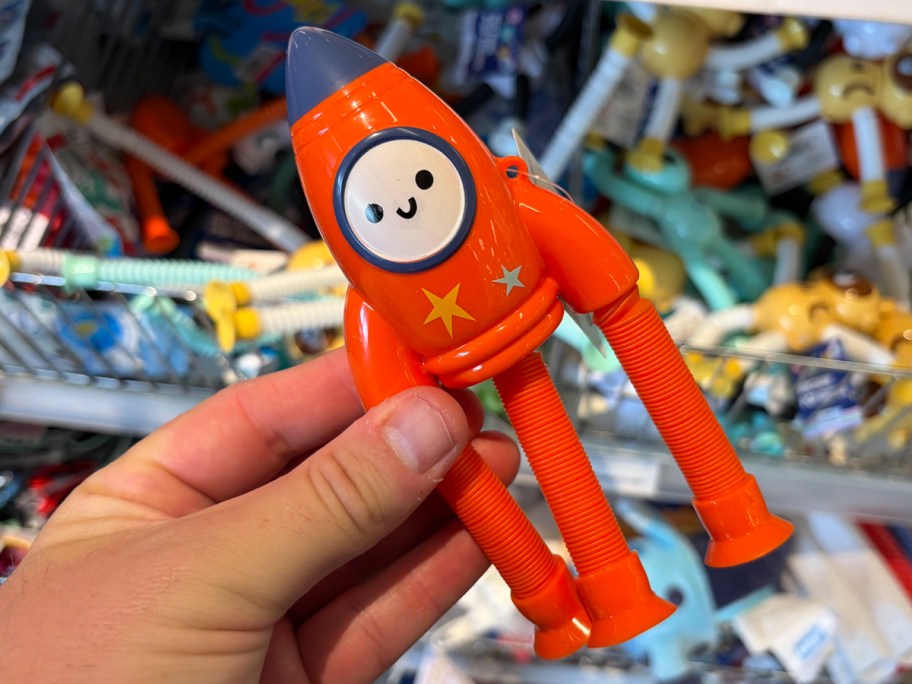 hand holding rocket toy