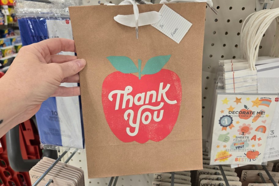 brown paper bag with red apple thank you