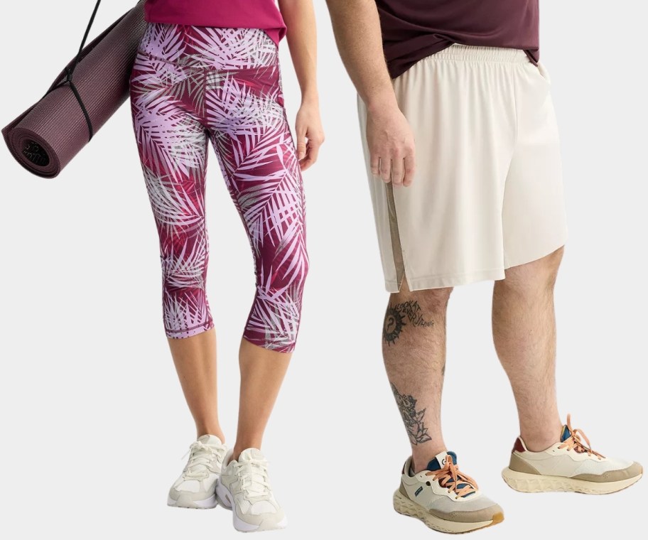 a woman ina. pair of leggings and a man in a pair of athletic shorts