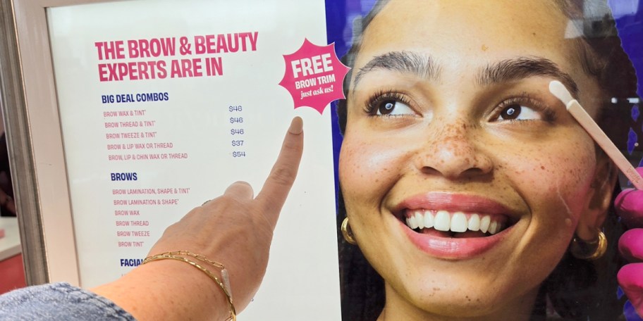 hand pointing to free brow trim sign 