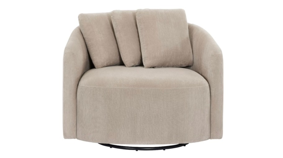 stock photo of beige swivel chair with pillows