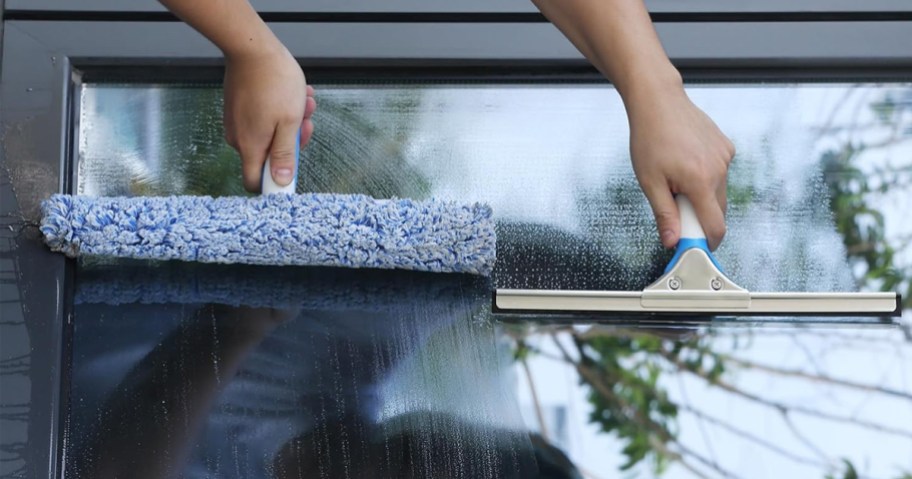 person cleaning windows