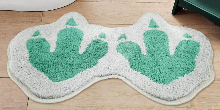 dinosaur bath rug on floor 