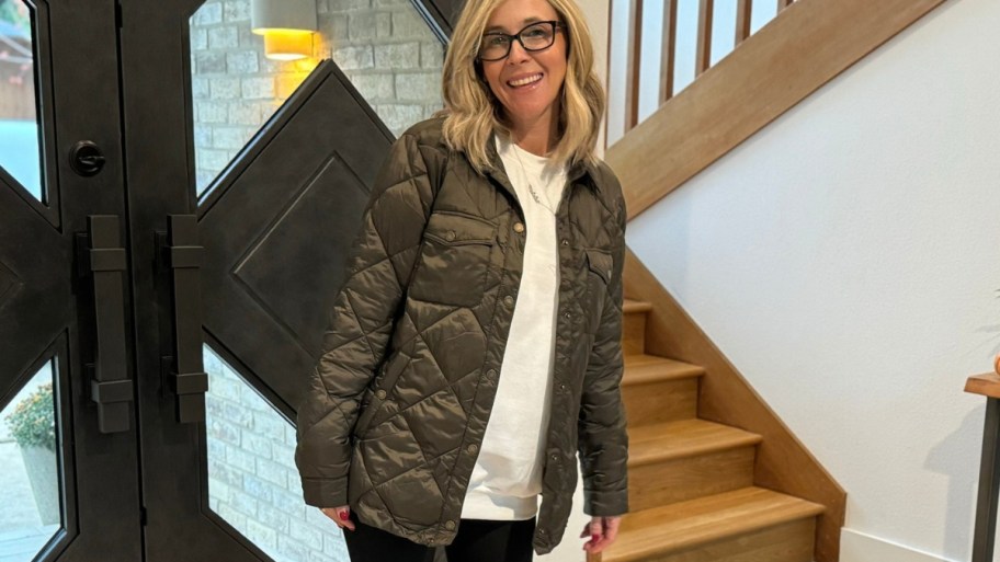 a woman in a quilted shirt jacket