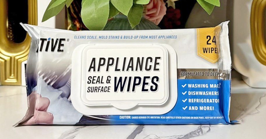 pack of Active Appliance Wipes on counter in front of flowers