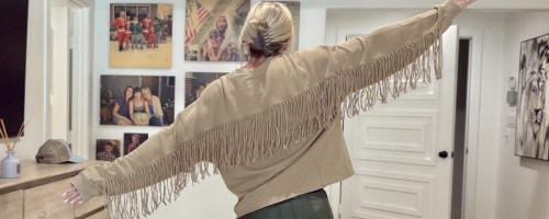 woman wearing Aerie Festival Fringe Crew Sweatshirt in brown color