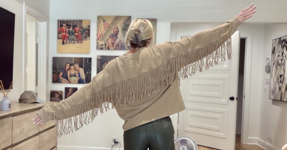 woman wearing Aerie Festival Fringe Crew Sweatshirt in brown color
