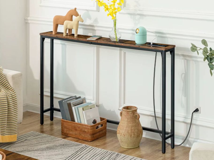A skinny console table with USB and outlets built into it
