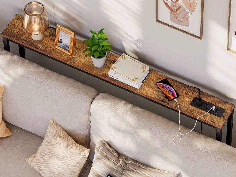 top down view of a console table behind a sofa