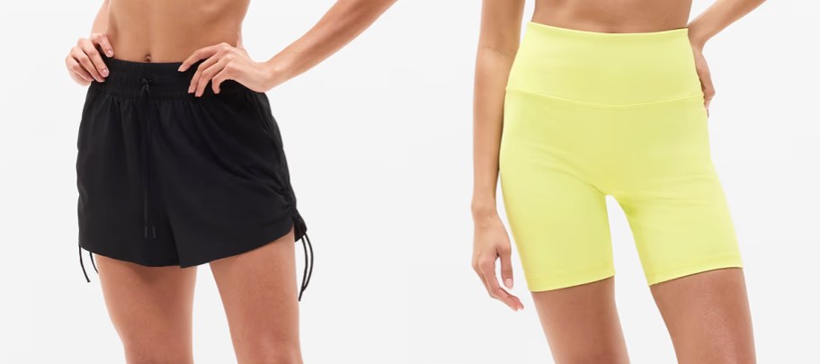 two women in black and yellow shorts