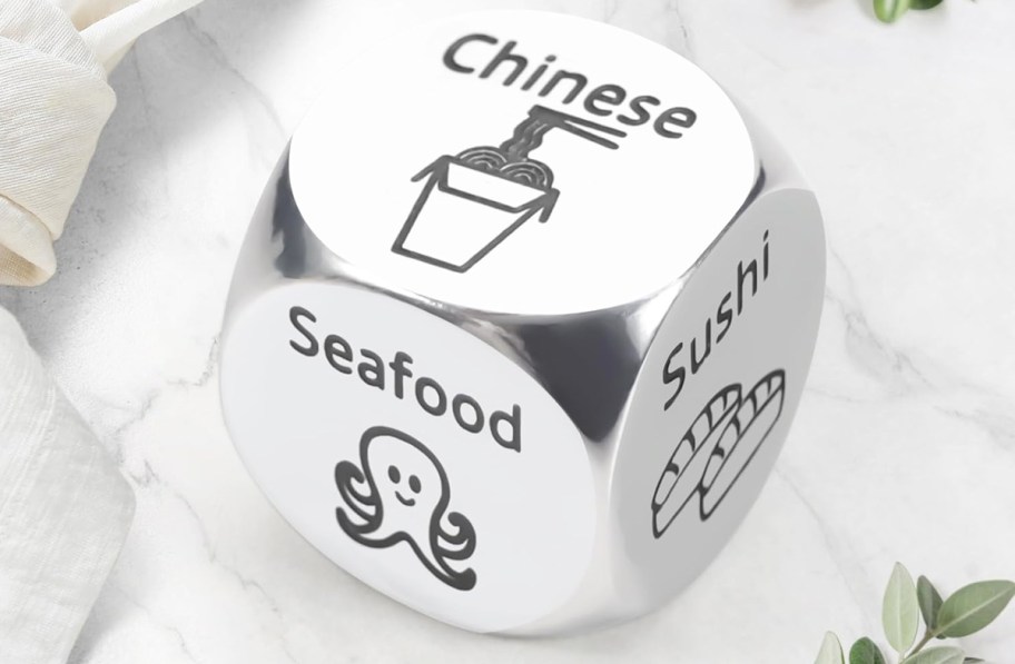 metal die with chinese, seafood, and sushi on each side