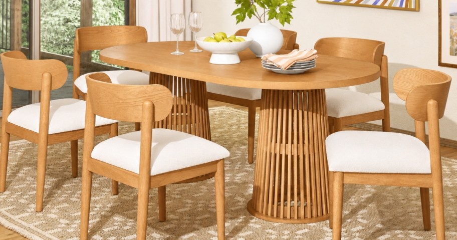 beautiful by drew barrymore oval dining table with chairs in dining room