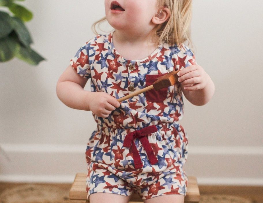 Little girls wearing a burt's bees americana romper