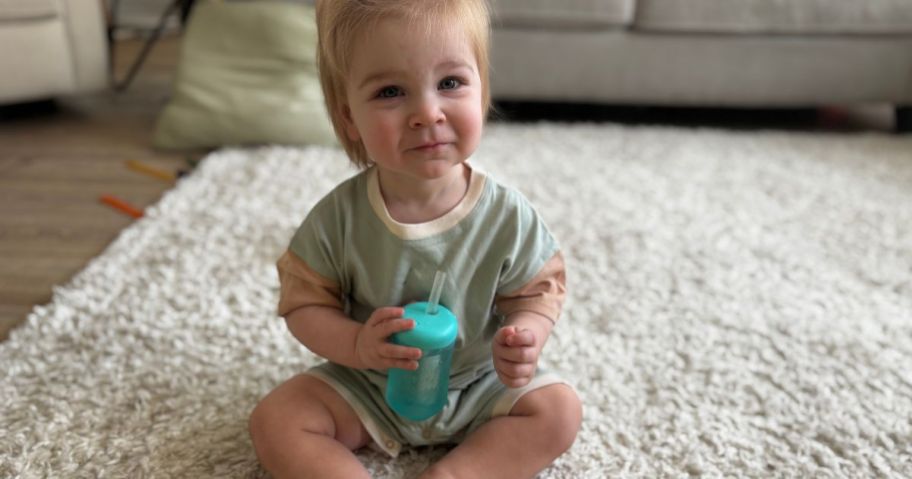 Baby wearing Burt's Bees romper