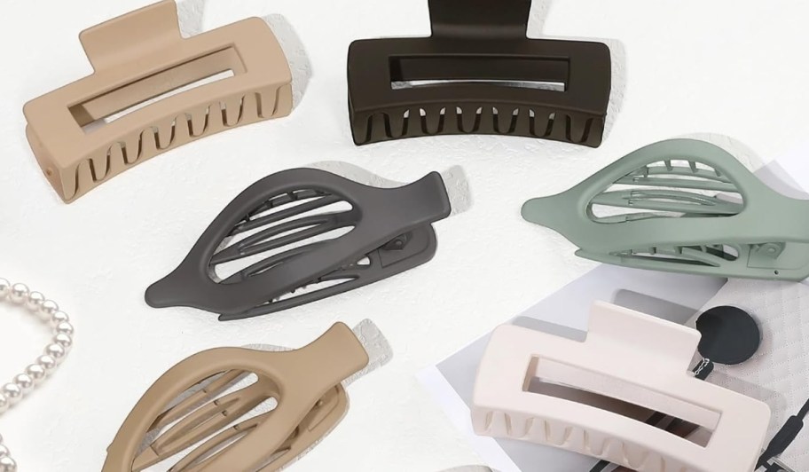 set of large size claw clips in different colors laying on table