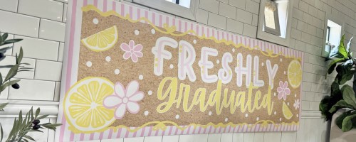 graduation photo banner on wall