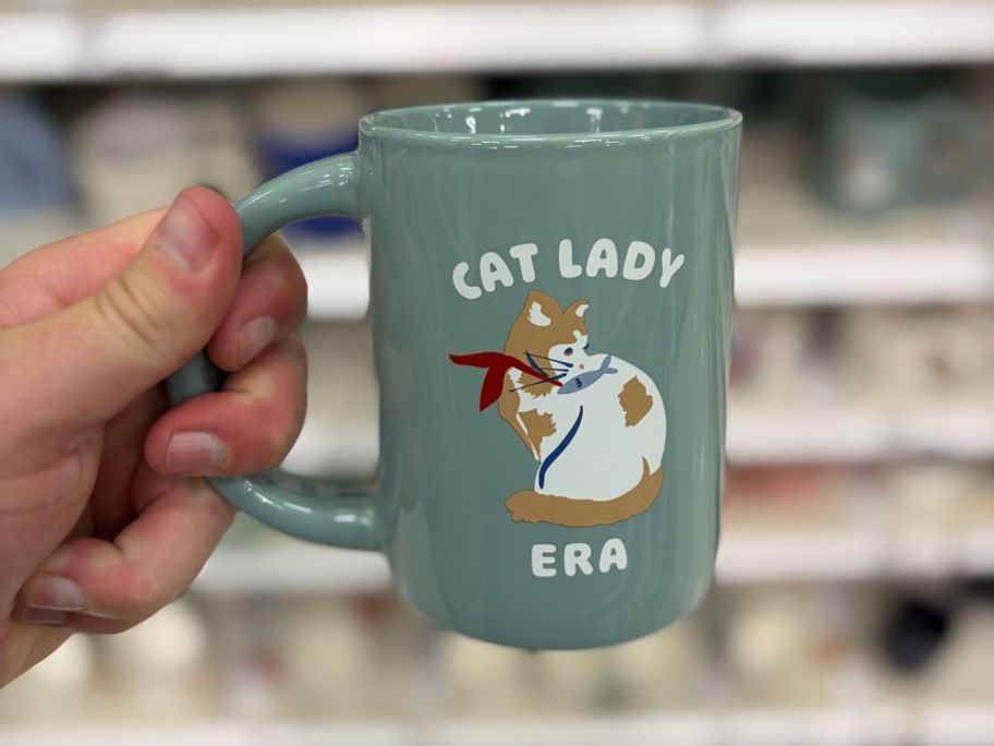 Cat Lady Era Mug in hand in store