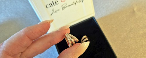 hand holding a silver earring