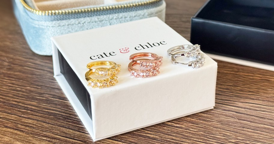 3 pairs of earrings on top of a Cate & Chloe box