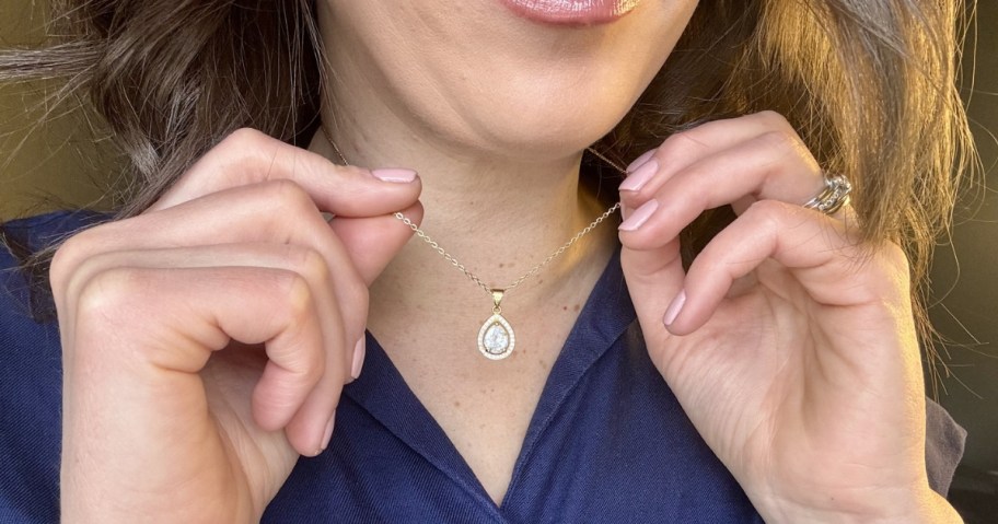 woman wearing cate & chloe isabel necklace with a drop pendant shape