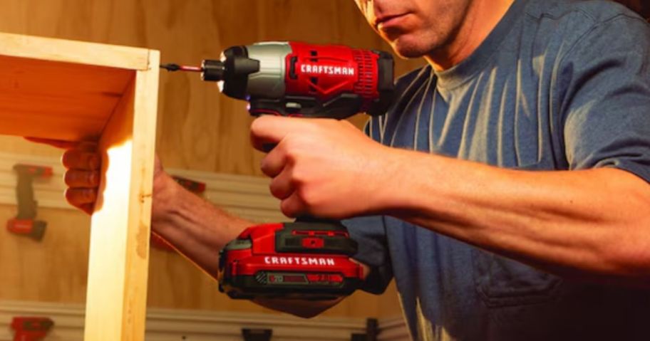 Man using a craftsman drill