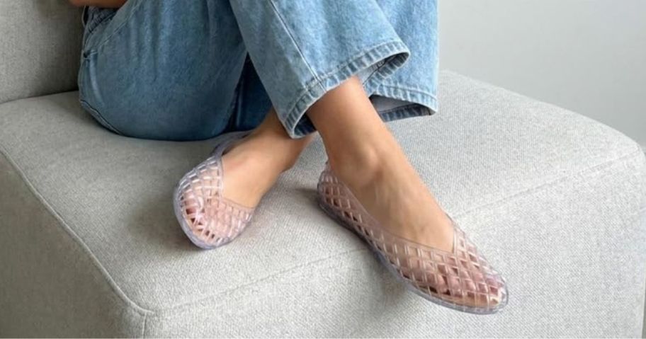 Woman wearing Cushionaire Clear Jelly Flats with jeans