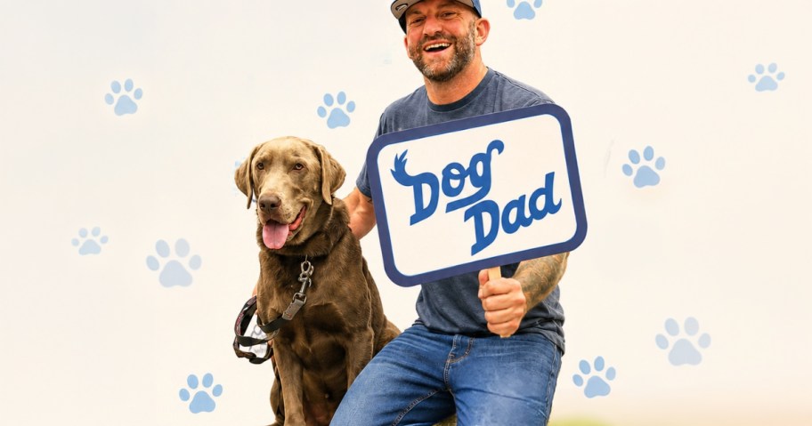 Man and dog posing for a Dog Dad Petco photo