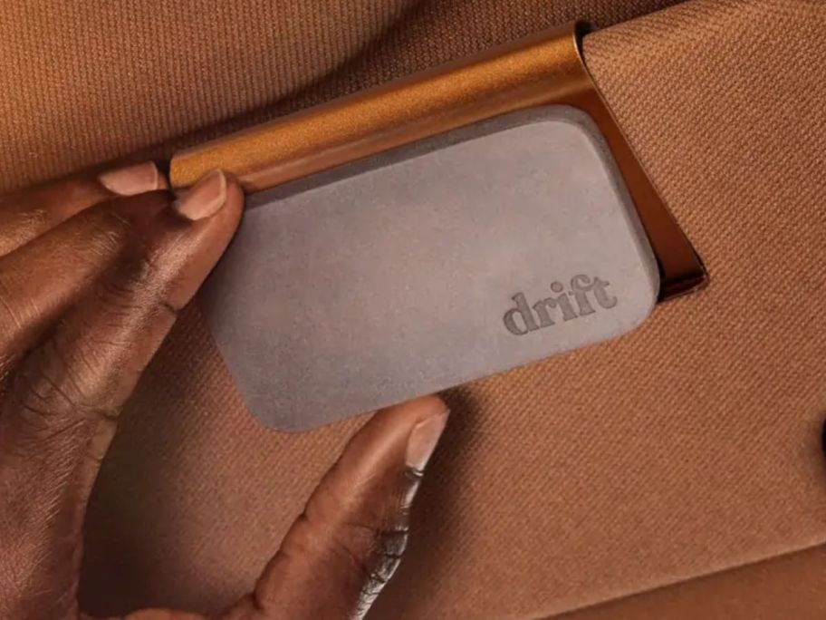 hand holding Drift Stone Car Freshener Starter Kit