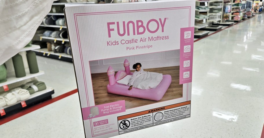 hand holding Funboy Kids Air Mattress box in store