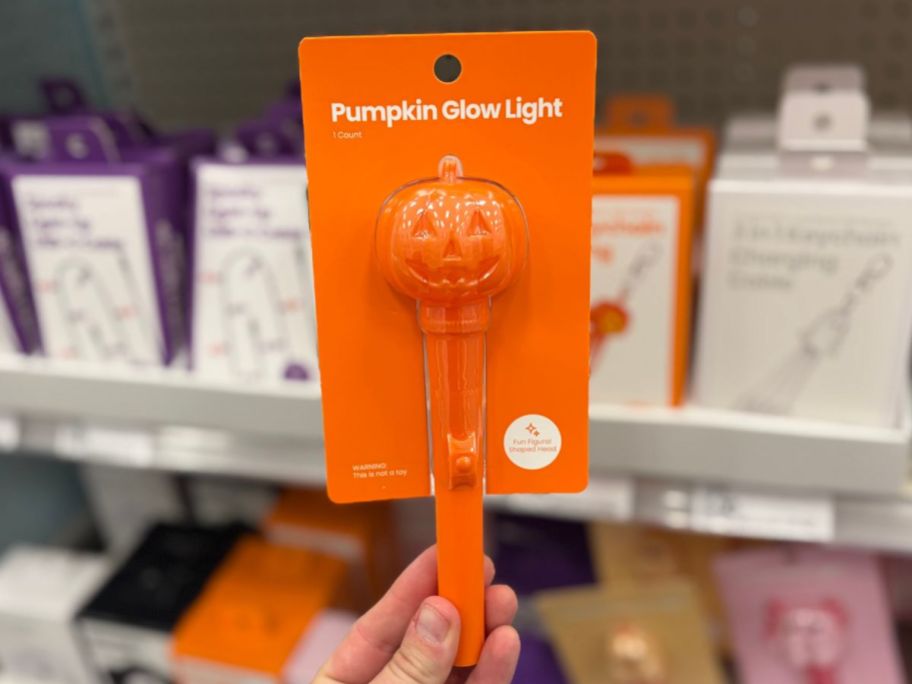GEMS Figural Halloween Glow Light Pumpkin in hand in store