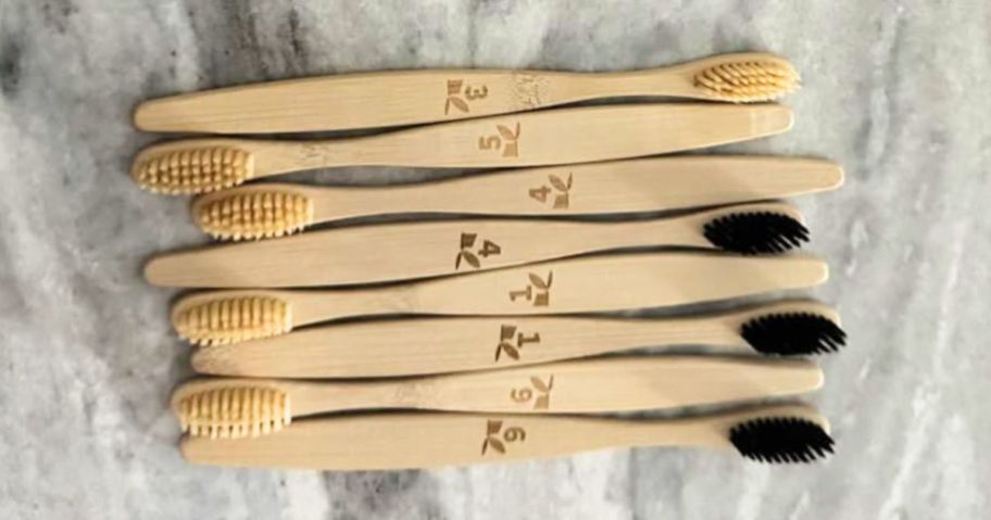 GENKENT bamboo toothbrushes on bathroom counter