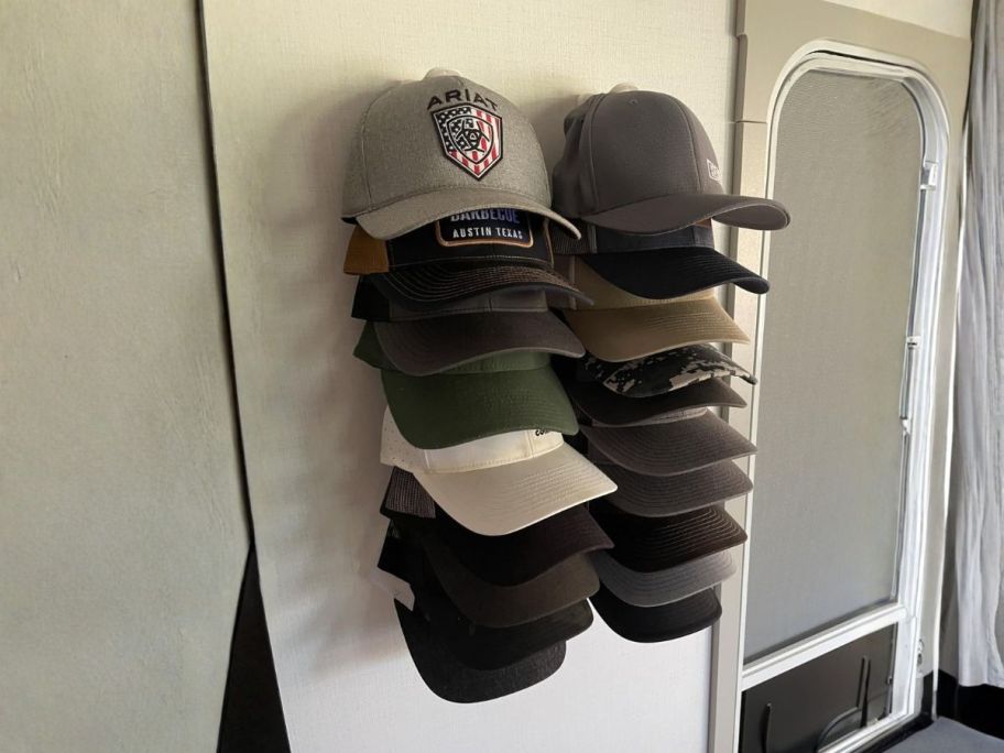 HeQe Hat Organizer 2-Pack in Black on wall displaying hats